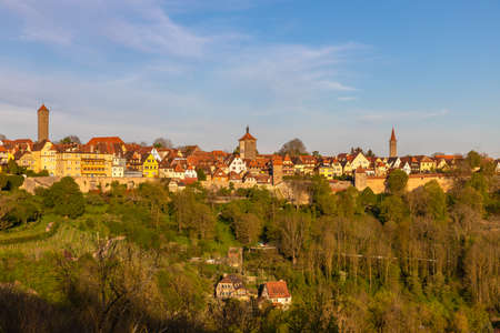 Panorama view of the medieval town Rothenburg ob der Taube and the river valley from the castle garten at sunset, Bavaria, Germanyの写真素材