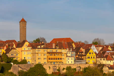 Beautiful view of the medieval town Rothenburg ob der Taube and the river valley from the castle garten at sunset, Bavaria, Germanyの写真素材