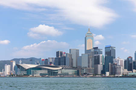 View of the Skyline of the Victoria Habour in Hong Kong on a sunny day, Chinaの写真素材