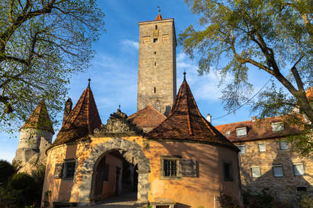 View of the Burg Gate (Burgtor) and Gate Tower (Burgtorturm) , the entrance from the castle garden to the medieval old town of Rothenburg ob der Tauber, Bavaria, Germanyのeditorial素材