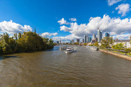 Stunning of the skyline of Frankfurt am Main with skyscrapers and mordern buildings on the river bank of Main, with magnificent cloudscape, Hesse, Germanyの写真素材