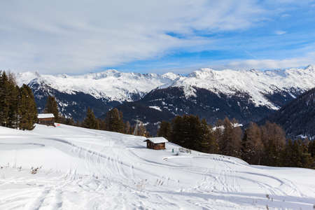 Beautiful view of the alps from Schatzalp in winter on a sunny day, Davos, Canton of Grisons, Switzerland.の写真素材