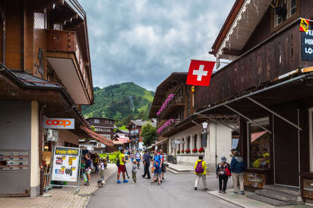 Murren, Switzerland - July 30, 2016 - Tourists visiting the small village Murren near Interlaken, a famous touristic place  on Bernese Oberland, Switzerlandのeditorial素材