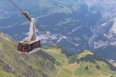 Murren, Switzerland - July 30, 2016 - Tourists taking the cablecar to the top of Schilthorn, a...