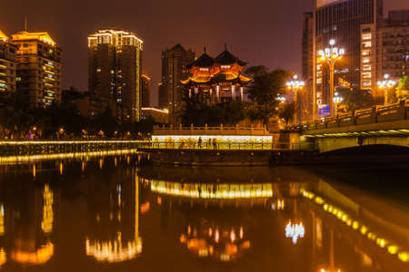 Night view of Hejiang Pavilion with beautiful illumination in Chengdu, Sichuan Province, China. The pavilion is at the location where the Fu River and Nan River combine and form the Funan River (Jin River).の写真素材