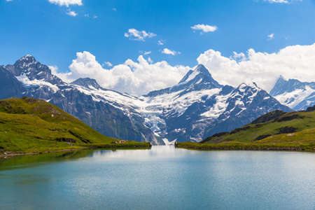 Panorama view of Bachalpsee and the snow coverd peaks including Schreckhorn, Wetterhorn with glacier of swiss alps, on Bernese Oberland, Switzerland.のeditorial素材