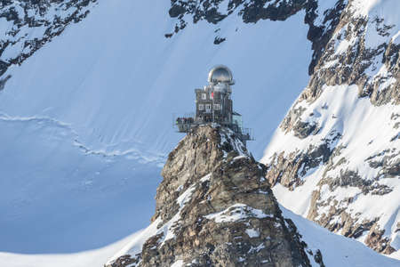 View of the Sphinx Observatory on Jungfraujoch, one of the highest observatories in the world located at the Jungfrau railway station, Bernese Oberland, Switzerland.のeditorial素材