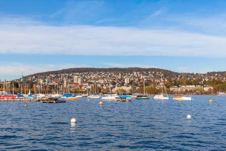 Beautiful view of the Zurich old town before sunset from the lake side at Mythenquai,, Zurich, Switzerlandのeditorial素材
