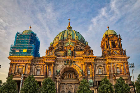 Front view of the historical Berlin Cathedral at sunset, located on the museum island in center of Berlin, Germany, with one dome in renovation.のeditorial素材