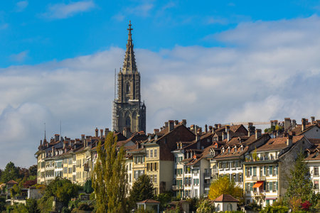 Beautiful view of Bern old town with the tower of Bern Minster (MÃ¼nster) cathedral on a sunny...