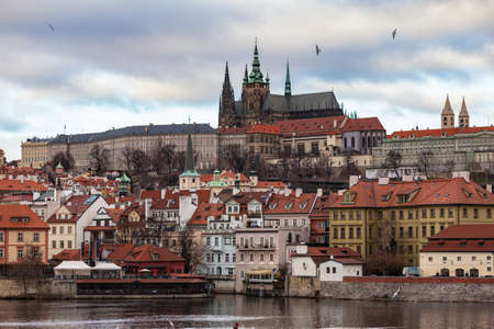 Beautiful view of Prague Castle and St. Vitus Cathedral located in Mala Strana old district on the Vltava river side of Prague on winter day with blue sky cloud, Czech Republicのeditorial素材