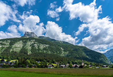 Beautiful idyllic panorama view of Altaussee town with the peak Loser in background on a sunny summer day with blue sky cloud, Styria, Austriaの写真素材
