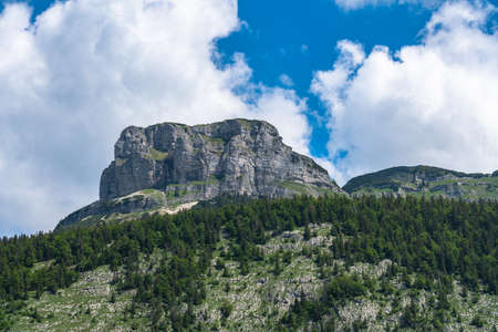 Stunning view of the steep cliff of peak Loser above Altaussee lake on a sunny summer day with blue sky cloud, Salzkammergut-Ausseerland region, Styria, Austriaの写真素材