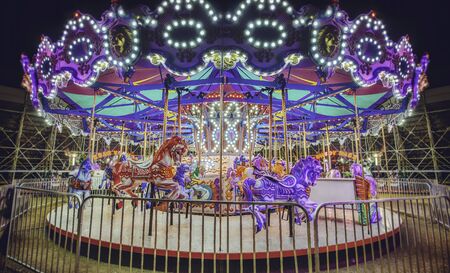 Fair.Carousel with horses. Horse rides kids carousel at the fairの写真素材