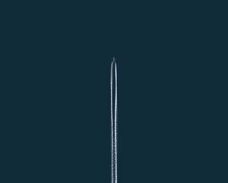 Airplane in the sky, view from the bottom. Vacation and travel concept. Clean and minimal look. Great image for your creative projects.の写真素材