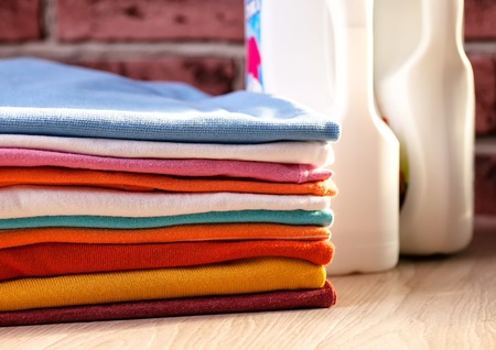 Clean, colorful, folded clothes. Means for washing clothes.の写真素材