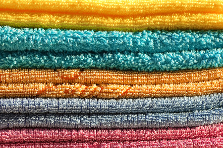 Clean, colorful, folded clothes. Means for washing clothes.の写真素材