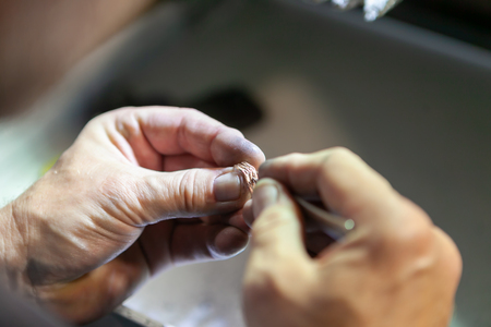 Work of the master, jeweler. Jewelry repair shop. Manufacturing of jewelry.の写真素材
