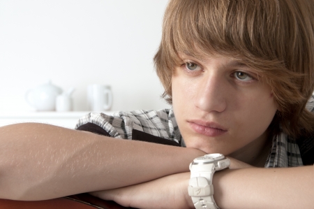Portrait of Teenage Boy putting his hands on the guitar Looking thoughtfullの写真素材