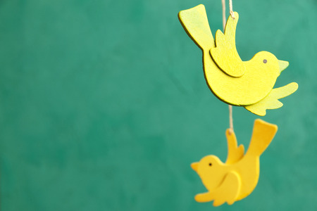 Wooden yellow and lime green on green backgroundの写真素材