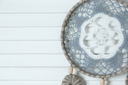 White gray dream catcher in bedroom interior on door background. Bedroom decorの写真素材