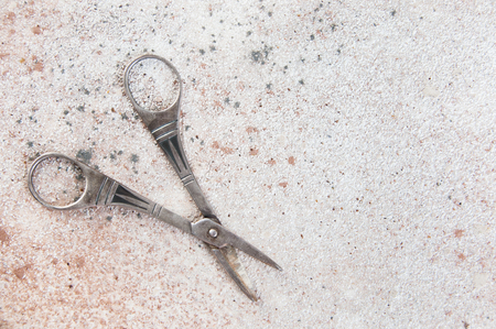 Vintage scissors close up on a concrete background . Copy space for text.の写真素材