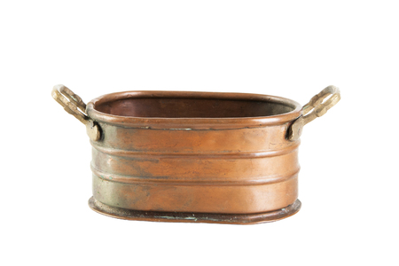Vintage copper flower pot with brass handles isolated on whiteの写真素材
