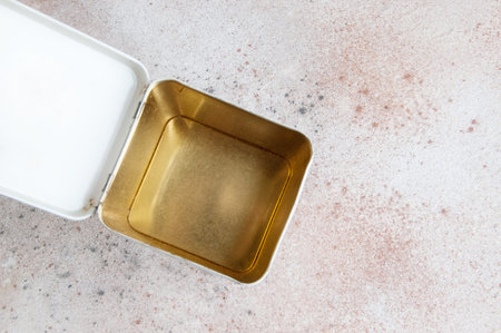 Top view in vintage tin box on concrete background. Copy space for text.
