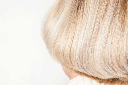 Blonde female hairstyle close up on whiteの写真素材