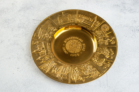 Vintage brass plate on concrete background. Copy space for text.の写真素材