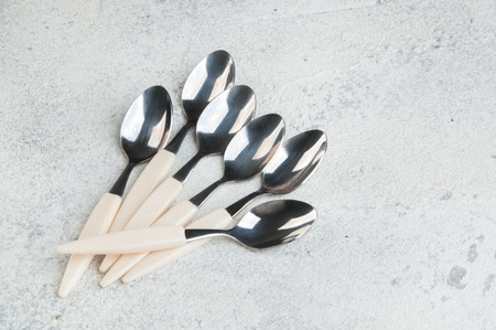 Vintage coffee spoons on concrete background. Copy space for text.の写真素材