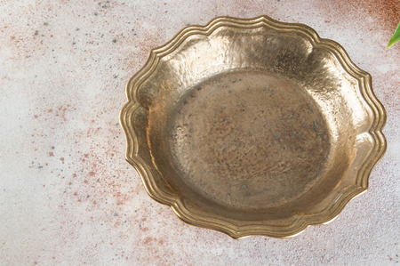 Vintage brass plate on concrete background. Copy space for text.の写真素材