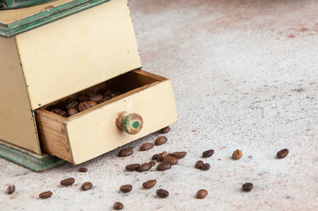 Old wooden coffee grinder on concrete background. Copy space for text.の写真素材