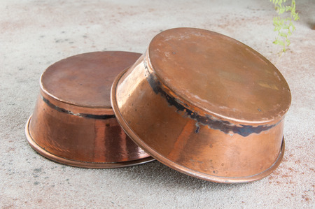 Vintage copper cookie molds on a concrete background. Copy space for text.の写真素材