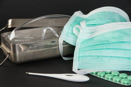 Medical protective masks, corona virus protection, doctor mask on black background. Copy space for text.の写真素材