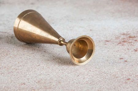 Antique brass candlestick on concrete background. Copy space for text.の写真素材