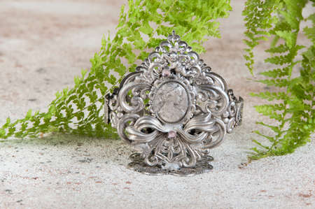 Antique metal napkin holder on concrete background. Food photography propsの写真素材