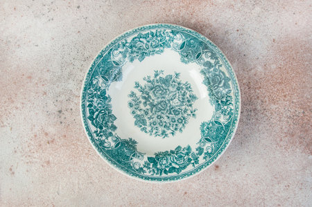 Antique porcelain dish on concrete background. Copy space for text, food photography props.の写真素材