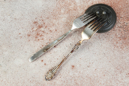Two old metal forks. Copy space for text, food photography props.の写真素材