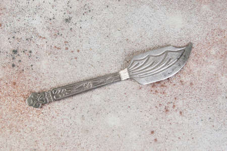 Old metal spatula on concrete background. Food photography propsの写真素材
