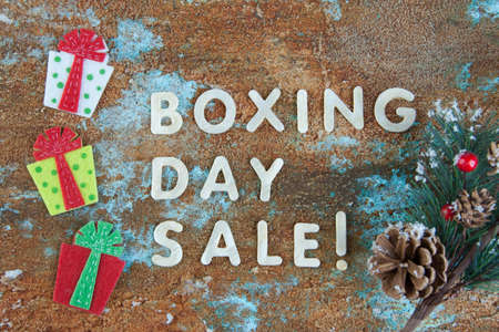 Boxing day sale and felt gift boxes on shabby background.の写真素材
