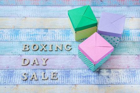 Three gift boxes on shabby background. Boxing day sale and copy space for text