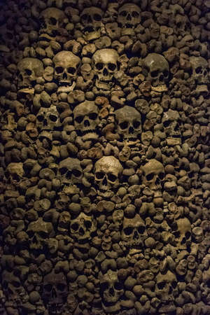 real wall human skulls bones skeleton ossuary burial siteの写真素材