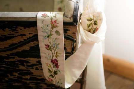historical pushchair ribbon detail with ornamental embroidery flowersの写真素材