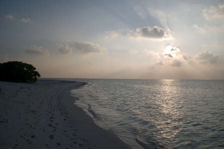 Sunset over ocean in Feridhoo, Maldivesの写真素材