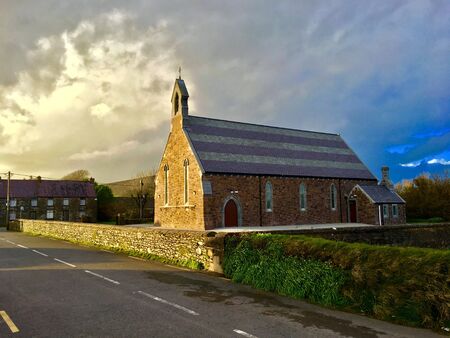 Irish church illuminated by the sunの写真素材