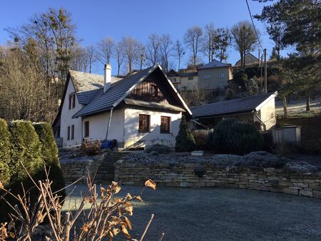 View of traditional Czech cottage covered with frostの写真素材