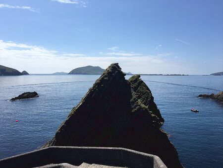 Western ireland, cliff, pier by the sea, beautiful blue water.の写真素材