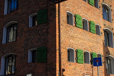 Beautiful windows and shutters on the facade of a historic house in Denmark.の写真素材