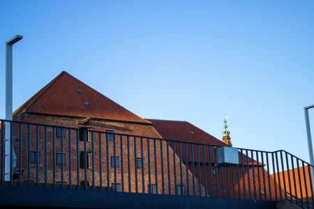 Beautiful windows and shutters on the facade of a historic house in Denmark.の写真素材